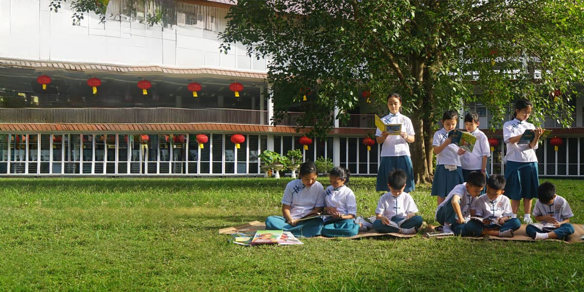 MAHANS students reading together on the school grounds